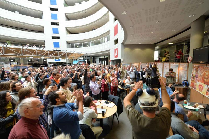 Members of the ATLAS and CMS collaborations react with jubilation at CERN as the announcement is made 