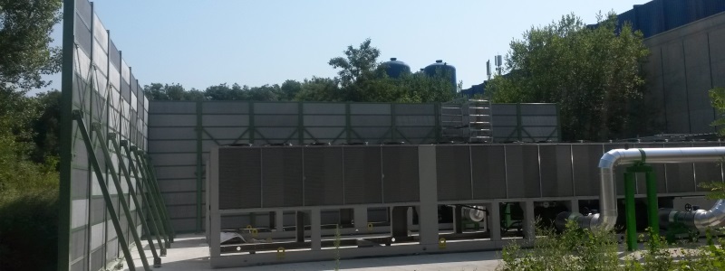 A noise barrier put in place on a CERN site to reduce noise from industrial equipment.