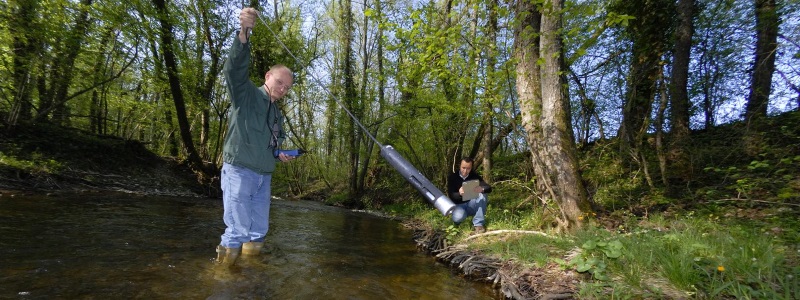 CERN experts controling water in a river