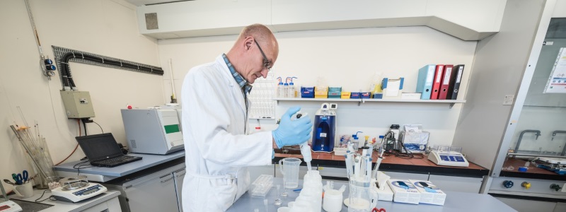 A environmental chemist at CERN testing samples containing water from neighbouring streams